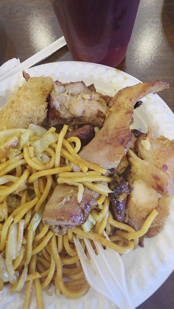 Buffet trays with assorted Chinese dishes.